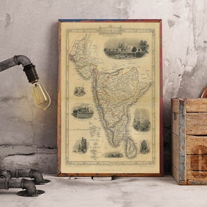 May include: A vintage map of South America in a wooden frame, with a rustic lamp and a wooden crate in the background.