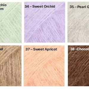 May include: A collection of six yarn samples in various colors. The colors include Pistachio Ice Cream, Sweet Orchid, Pearl Grey, Almond, Sweet Apricot, and Chocolate. Each sample is labeled with a number and color name.