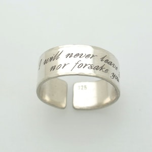 May include: Silver ring with the inscription "I will never leave nor forsake you".