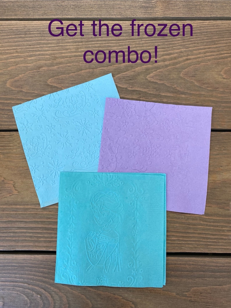 May include: Three paper napkins with a Frozen theme. The napkins are blue, purple, and teal. The blue napkin has a snowflake pattern, the purple napkin has a snowflake pattern, and the teal napkin has an image of Elsa from Frozen.