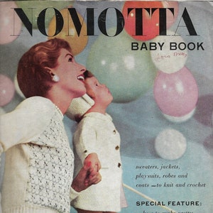 May include: A vintage magazine cover featuring a mother and child wearing white knitted sweaters and dresses. The cover is titled "Nomotta Baby Book" and features the text "sweaters, jackets, playsuits, robes and coats - to knit and crochet" and "SPECIAL FEATURE: ...how to make pretty baby gift wrappings with left-over wool."