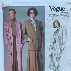 May include: A sewing pattern for a long pink coat and a brown skirt suit. The pattern is from Vogue Patterns, American Designer, and the pattern number is 1775.