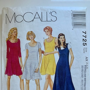 May include: McCall's sewing pattern 7725 for a one-hour dress. The pattern includes four different dress styles: a red dress, a striped dress, a yellow dress, and a blue dress. The pattern is for sizes AX (4, 6, 8).