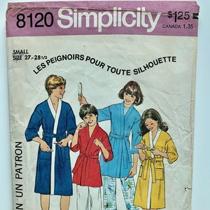 May include: Simplicity sewing pattern number 8120 for robes. The pattern is for sizes 27-28 1/2. The pattern shows four people wearing different coloured robes. The text on the pattern reads "Les Peignoirs Pour Toute Silhouette" and "The Every-Body Robes".