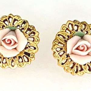 Vintage 1990s Pierced Earrings, Gold Filigree Backing with Delicate Pale Pink Ceramic Rose Centre and Pale Green Leaf. Good Condition.
