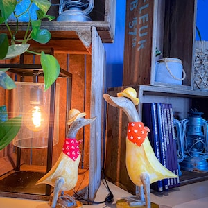 Wooden walking duck with flip flops and hat in antique yellow 35 cm