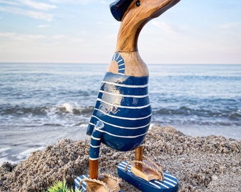 Runner duck with hat and flip flops in dark blue and white striped swimsuit 28 cm high