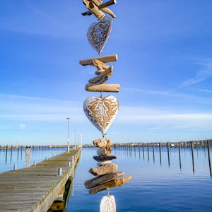 Wind chime 3 hearts made of wood antique natural white shabby chic with driftwood natural stone wall decoration.