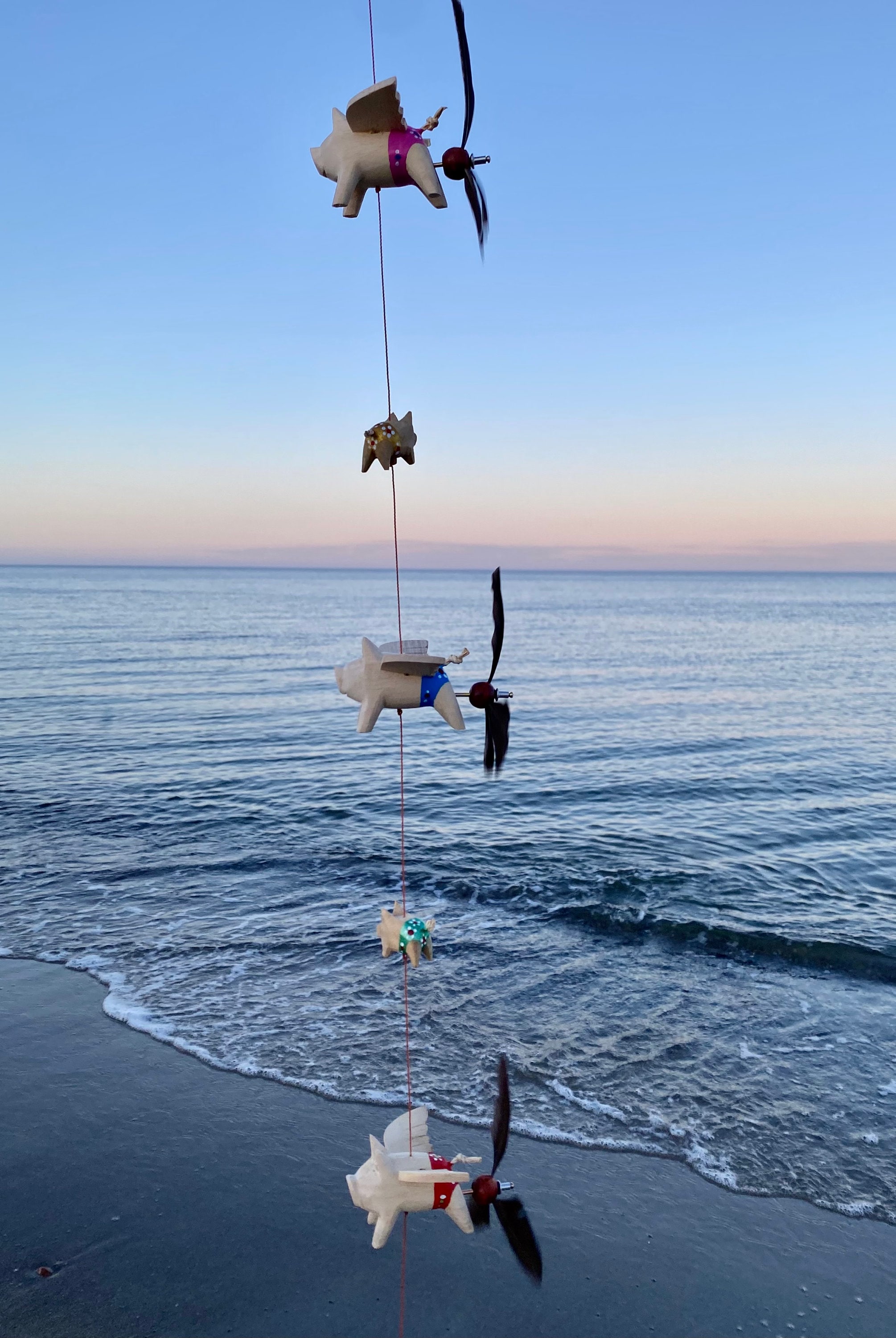 Wind chit with 3 piggy propellers and 2 babies with colorful swimming…