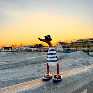 Runner duck with hat and flip-flop in white with dark blue stripes approx. 38 cm high