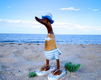 Running duck with hat and flip flops in a light blue and white striped swimsuit 25 cm high