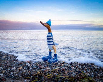 Laufente with blue boots, blue and white striped shirt and poodle cap about 25 cm high