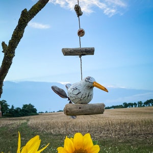 Wind chime 1 seagull with propeller on driftwood.