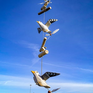 3 seagulls wind chime and driftwood with propellers
