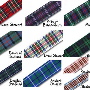 May include: A collection of ten different tartan ribbon samples, each with a unique pattern and color combination. The ribbons are labeled with their names, including Royal Stewart, Pride of Bannockburn, Mackenzie, Flower of Scotland, Dress Stewart, Black Watch, Raspberry (pink), Douglas (Modern), Ancient Douglas, and Blueberry (blue).
