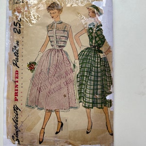 May include: Vintage Simplicity sewing pattern for a dress, featuring two models wearing different styles of dresses. The pattern number is 3252 and the price is 25 cents. The pattern is printed on a white background with a light brown border.
