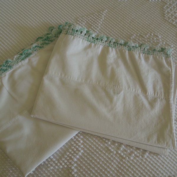 Pair of vintage white pillowcases with light green  crocheted trim edging