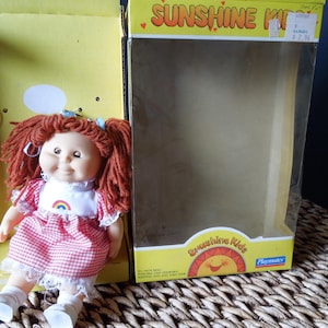 Sunshine Kids doll 8 1/2&quot; poseable and adorable with sleeping eyes and yarn hair. Vintage 1980&#39;s Made in Hong Kong NOS in box