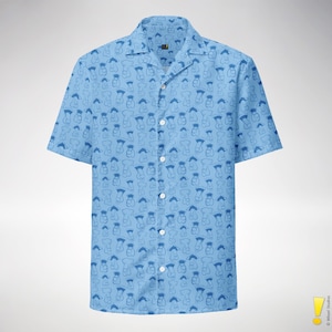 May include: Light blue button-down shirt with a repeating pattern of blue abstract shapes. The short-sleeved shirt has a camp collar and white buttons. The shirt is made of a lightweight fabric.