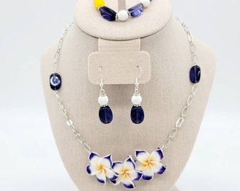Paradise in Bloom Beautiful Clay flowers and glass beaded necklace, bracelet, and earrings