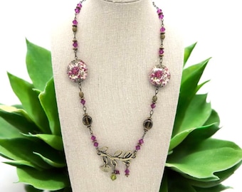 A Bird On A Branch Necklace Antique Bronze with Crystals and with floral beads and glass beads