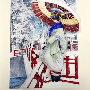 May include: Watercolor painting of a geisha in a winter scene. She wears a light green kimono, a blue scarf, and a traditional hairstyle. She holds a red and white parasol. The bridge and surrounding trees are covered in snow.