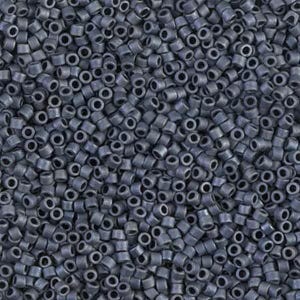 May include: A close-up view of a large quantity of small, round, dark gray beads. The beads are opaque and have a slightly metallic sheen.