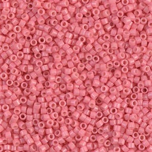 May include: A large quantity of small, round, pink beads. The beads are opaque and have a smooth, glossy finish.