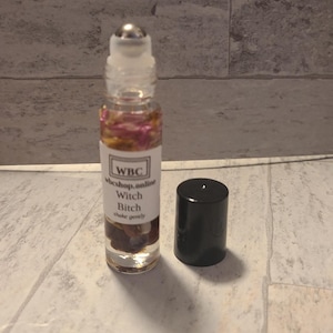 Witch Bitch Oil Roller, with healing mookaite crystals, florals and herbs