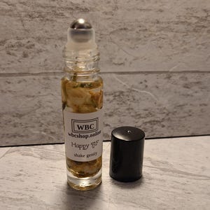 Happy AF, orange blossom scented, sunstone, citrine, tigers eye crystal infused oil roller