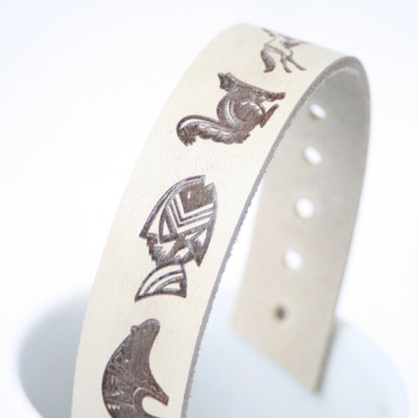 beige milky genuine leather bracelet wrap around wrist with engraved rustic tribal Native American Bear fish horse rabbit squirrel