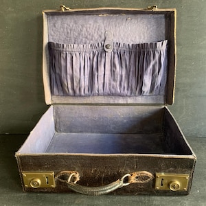 Small black grained leather travel suitcase from the 1920s
