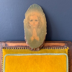 Portrait of a young girl, painting on an oval wooden log