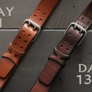 May include: Two leather belts with silver buckles, one is light brown and the other is dark brown. The belts are labeled "Day 1" and "Day 1321" to show the difference in color after being worn for a long time.