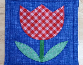 Applique Tulip HOTPAD in red check, cobalt blue, and grassy green