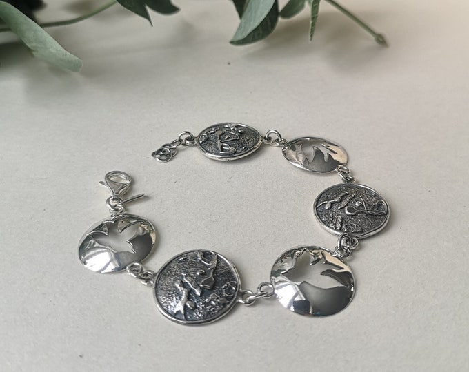 Bracelet with birds and textures handmade in sterling silver for women