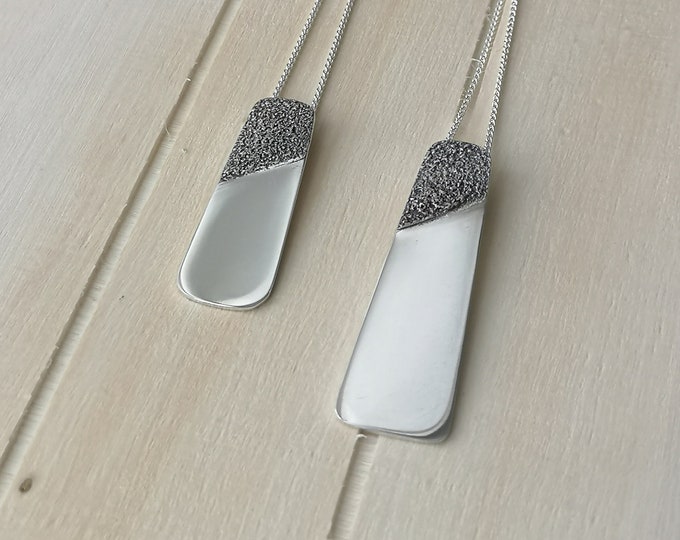 Handmade silver necklace with a rectangular pendant and a texture for women