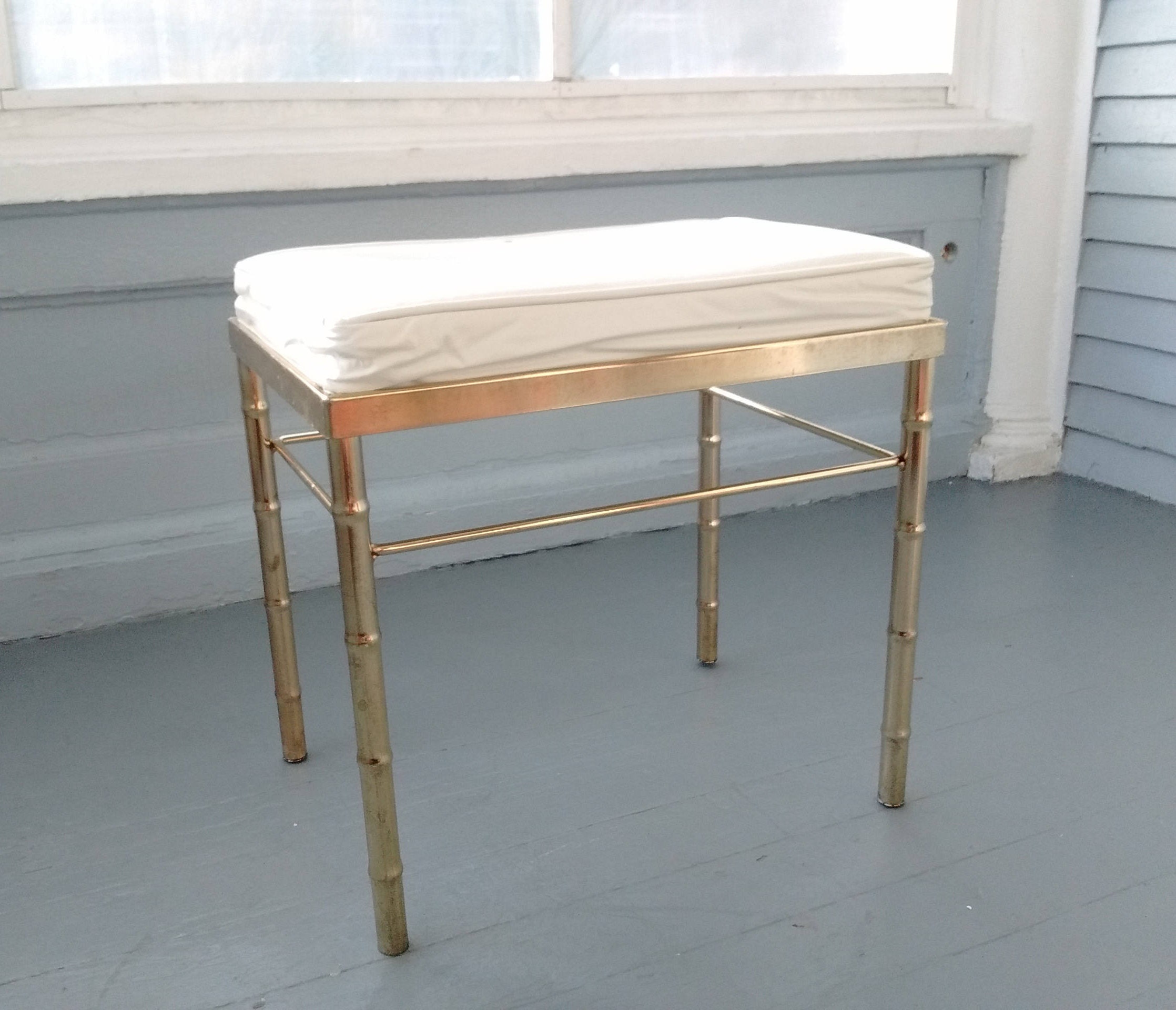 Brass plated stool.