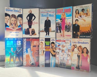 VHS Movies; The FamilyMan, Last Action Hero, MarciX, Man of the House, Sweet Home Alabama, Heart Breakers, Men in Black and More