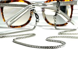 This Sunglasses chain is strong and functional, the silver chain is finished off with custom adjustable eyeglass grips for a secure hold.