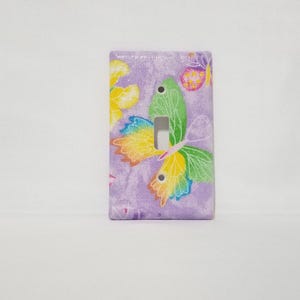 Butterfly Light Switch Plate Cover on Purple back ground, Sparkly Covered Fabric Switch Plate Cover