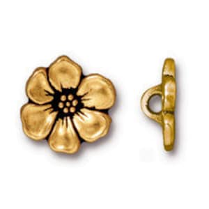 May include: Gold-tone metal flower button with a loop shank. The button has a raised, textured design and a small center detail.