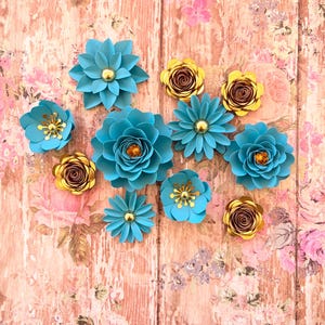 May include: A set of three ceramic mugs with a speckled, matte finish. The mugs are in shades of cream, light gray, and dark gray. Each mug has a simple, minimalist design and a rounded handle.