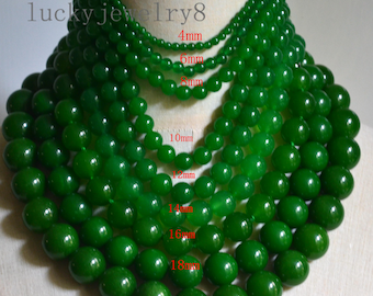 May include: A collection of graduated green jade bead necklaces. The beads range in size from 4mm to 20mm. The necklaces are displayed on a mannequin. The text "lucky jewelry8" is visible in the upper left corner.