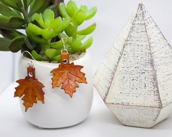 Maple leaf earrings hand dyed in orange, red, and yellow