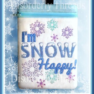 May include: White zippered pouch with blue trim and a zipper pull. The pouch has an embroidered design of snowflakes and the text "I'm Snow Happy!"