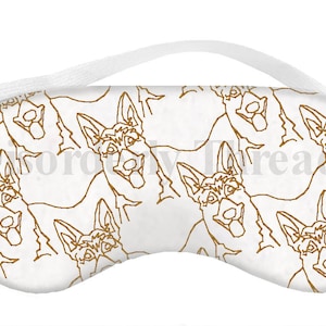 Può includere: Maschera per dormire bianca con un motivo ripetitivo di disegni a linea marrone di cani pastore tedesco.