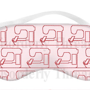 May include: A white sleep mask with a pink background and a repeating pattern of red sewing machines. The text "Disorderly Threads" is printed on the mask.