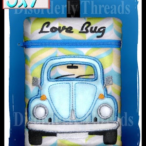 May include: A blue and white zippered pouch with a blue and white chevron pattern. The pouch features an embroidered image of a blue Volkswagen Beetle with the text "Love Bug". The pouch measures 5 inches by 7 inches.