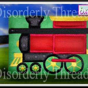 May include: A green zippered pouch with a red and black embroidered train design. The pouch measures 6x8.5 inches and has the text "Disorderly Threads" on the front.